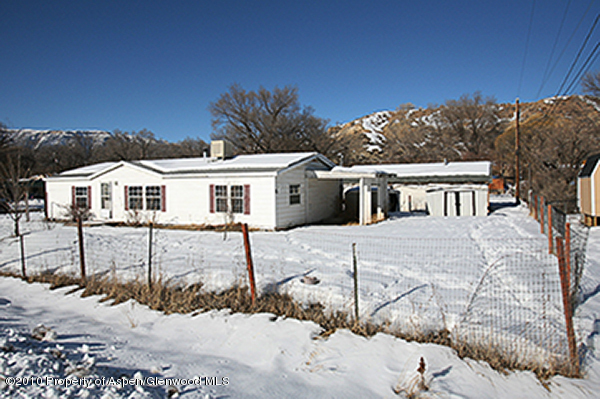 100 Ray Avenue Rifle, CO 81650 - Photo 1 of 9 a front view of a house with a yard