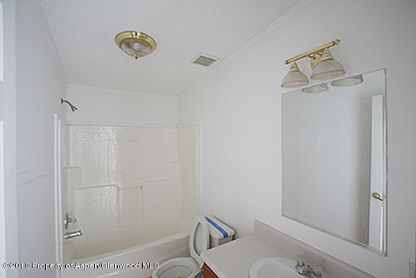 100 Ray Avenue Rifle, CO 81650 - Photo 4 of 9 a bathroom with a shower