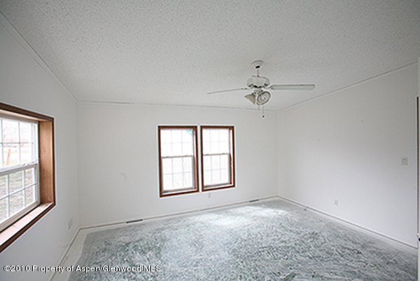 100 Ray Avenue Rifle, CO 81650 - Photo 7 of 9 an empty room with a window