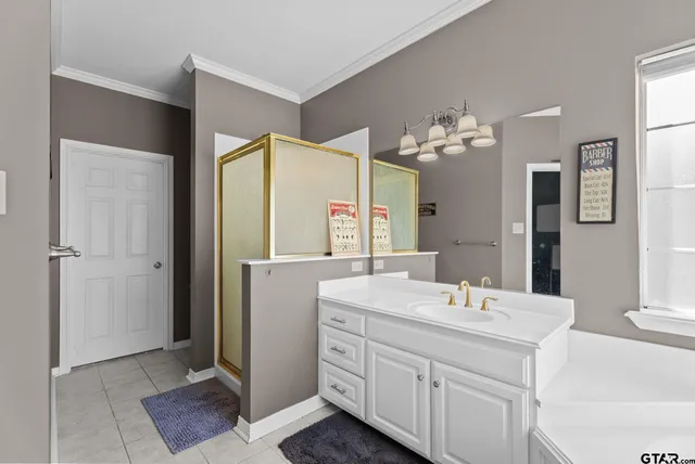 a bathroom with a double vanity sink mirror and