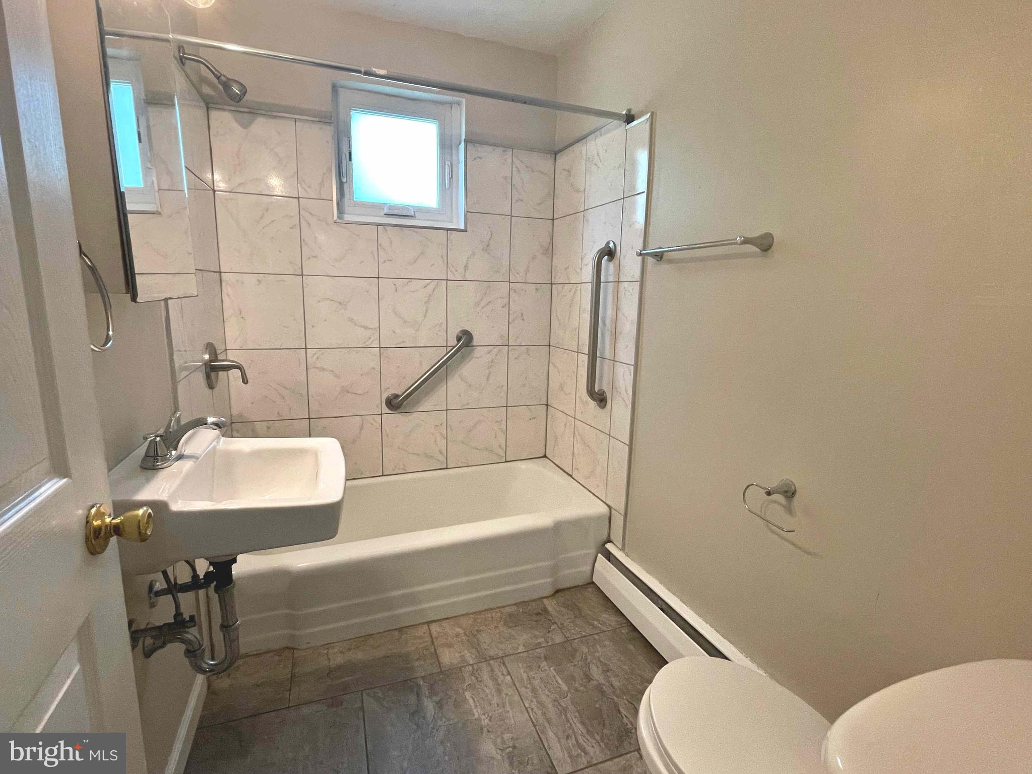 204 Old York Road, Unit 1 New Cumberland, PA 17070 - Photo 6 of 8 a bathroom with a sink and a mirror