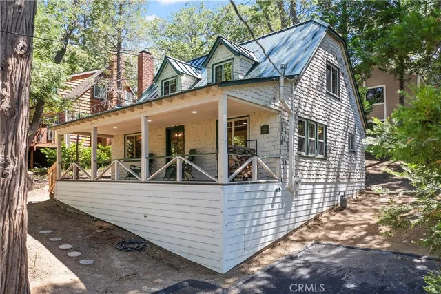 a view of a white house with large windows