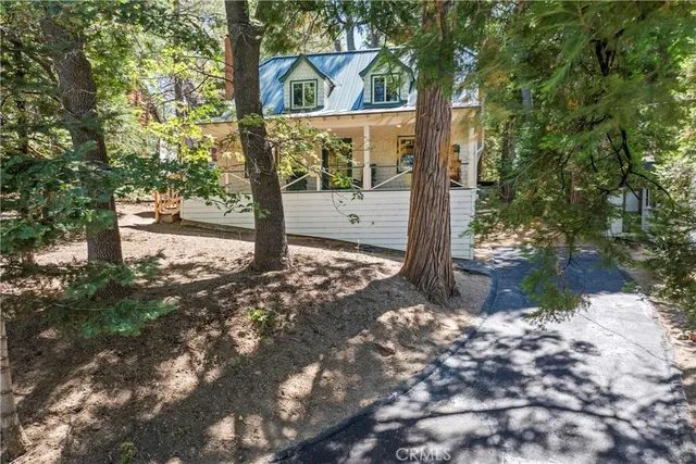 a view of a tree in front of a yard