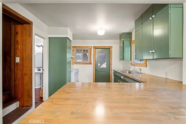 a bedroom with a bed and a large mirror