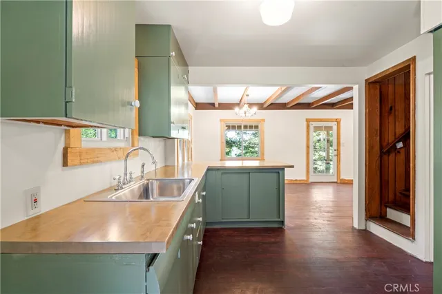 a kitchen with a sink and a large window