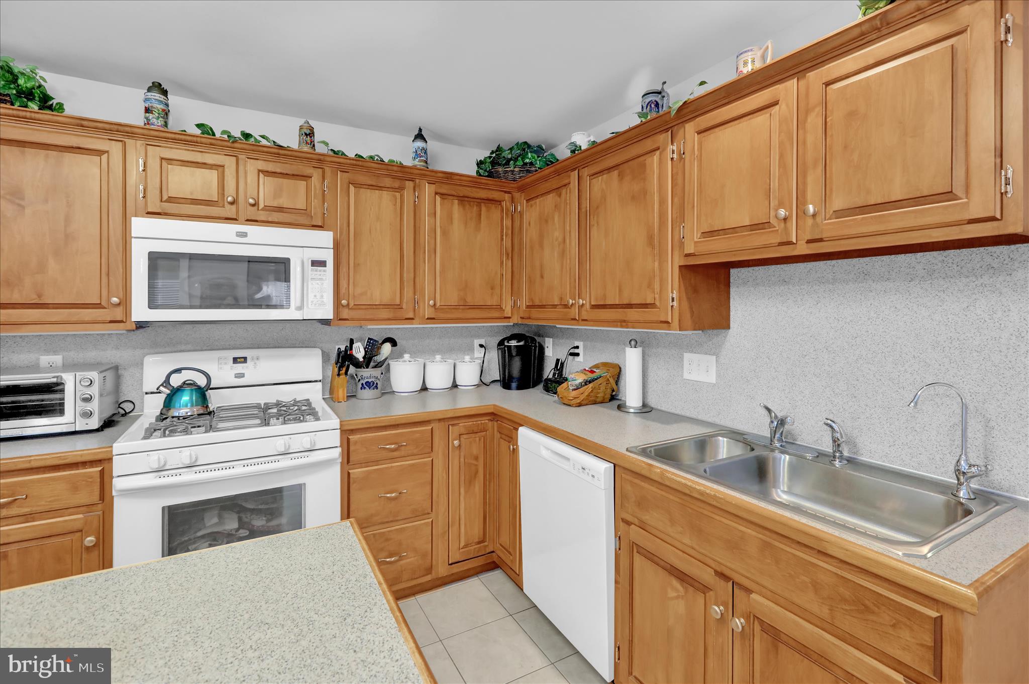 110 South Cacoosing Drive Reading, PA 19608 - Photo 12 of 32 a kitchen with stainless steel appliances granite countertop a sink a stove and cabinets