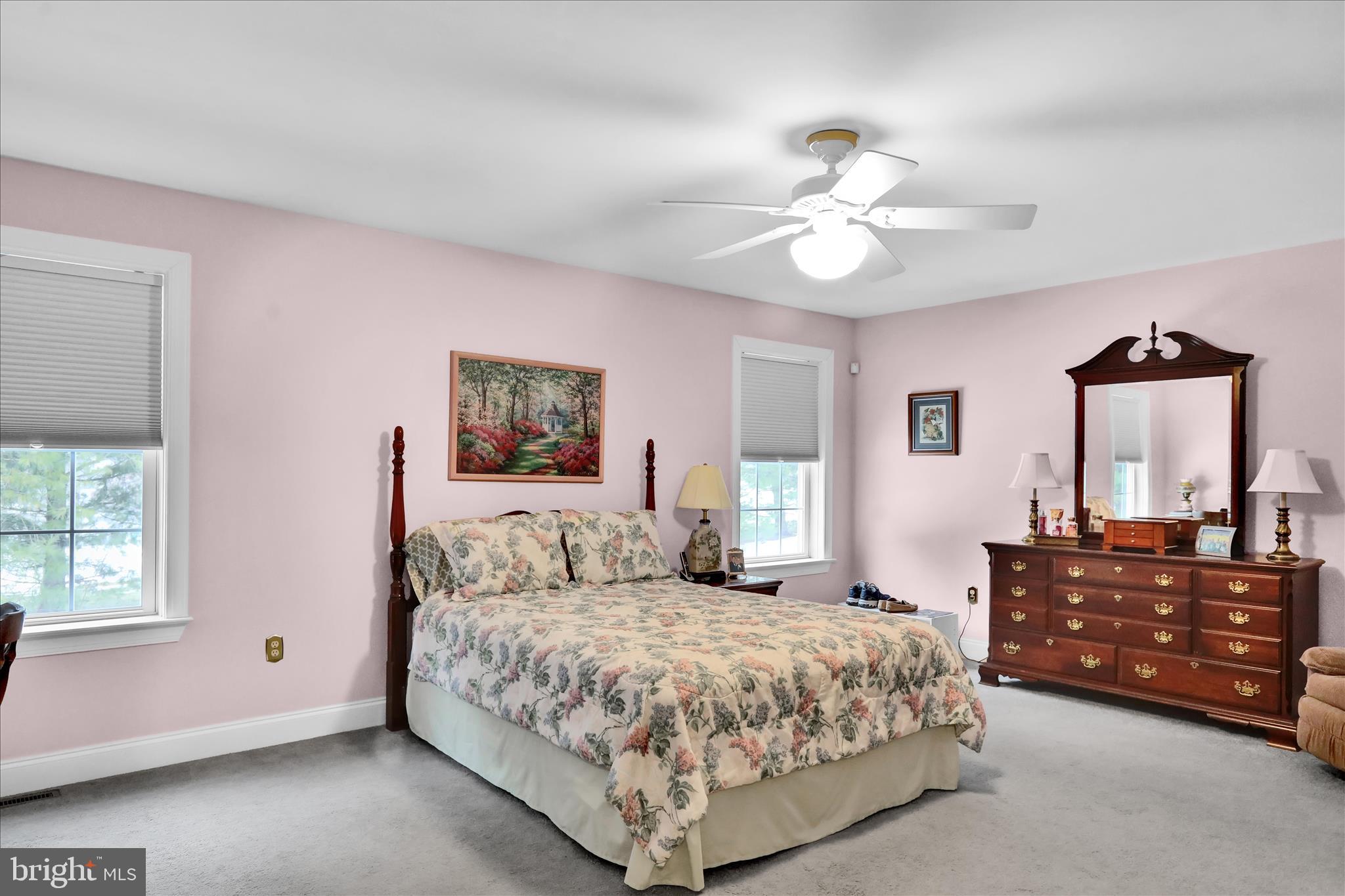 110 South Cacoosing Drive Reading, PA 19608 - Photo 18 of 32 a spacious bedroom with a bed and a chandelier