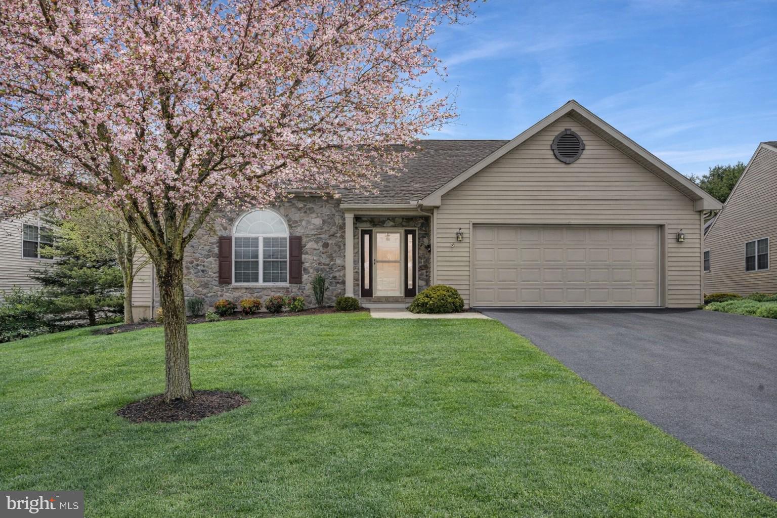 110 South Cacoosing Drive Reading, PA 19608 - Photo 31 of 32 a front view of a house with a yard and garage