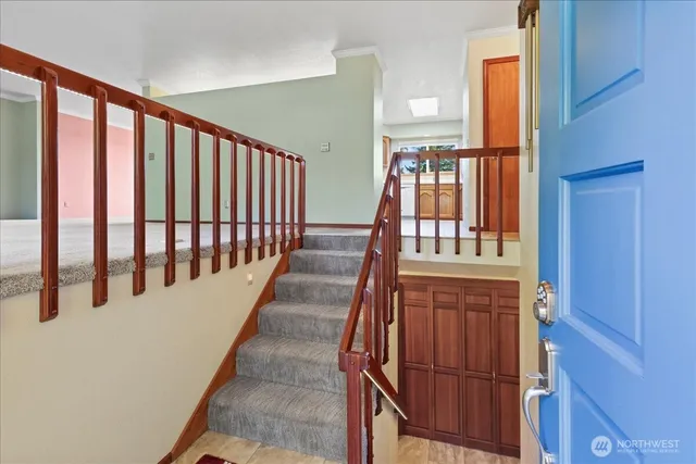 view of staircase with lots of wooden furniture