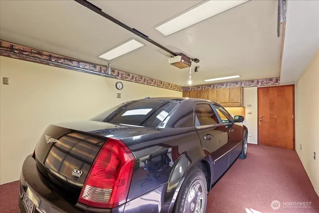 a bed room with a bed and a chandelier