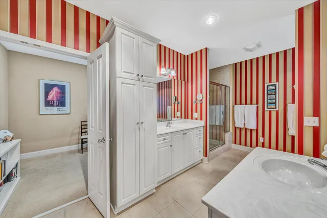 a spacious bathroom with a bathtub and a shower