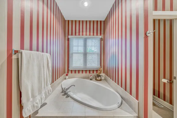 a bathroom with shower and bathtub