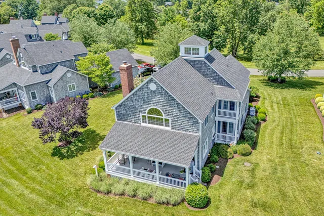 an aerial view of a house with swimming pool
