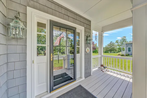 a view of a balcony with wooden floor