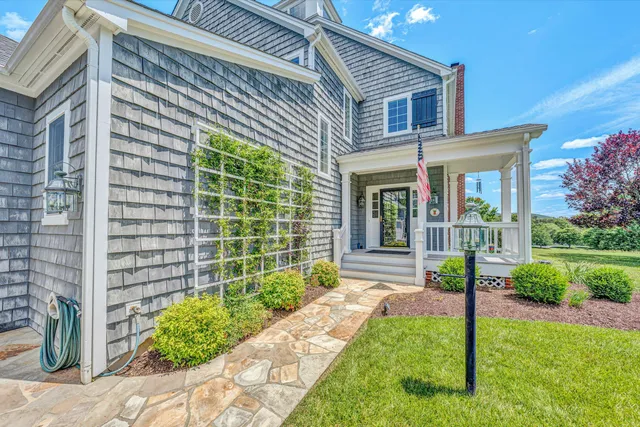 a front view of a house with garden