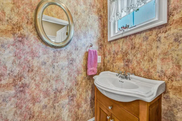 a bathroom with a sink and a mirror