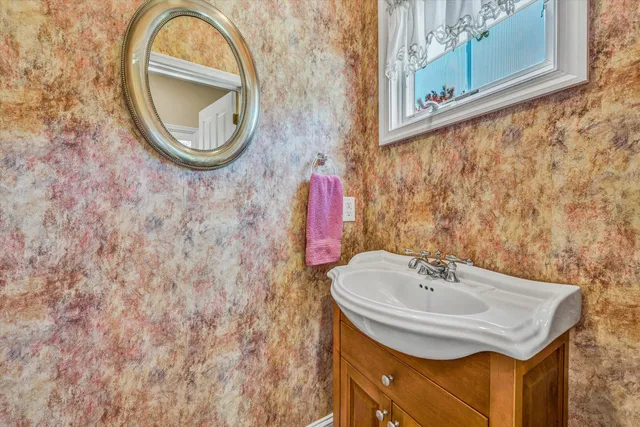a bathroom with a sink and a mirror