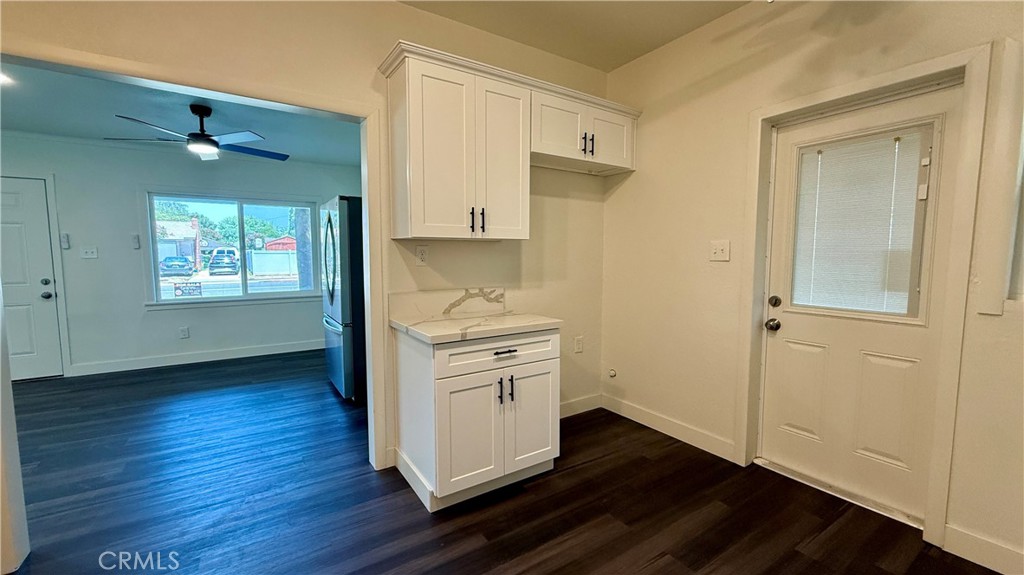 4542 Bandini Avenue Riverside, CA 92506 - Photo 12 of 22 a view of a kitchen with wooden floor a sink and windows