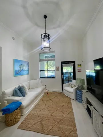 a spacious bedroom with a bed and a flat screen tv