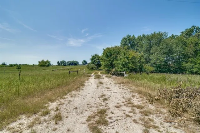 a view of a lake with houses in the back