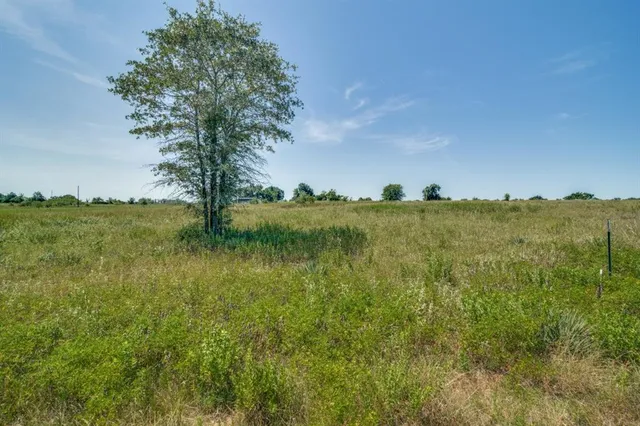a view of a lake with a yard