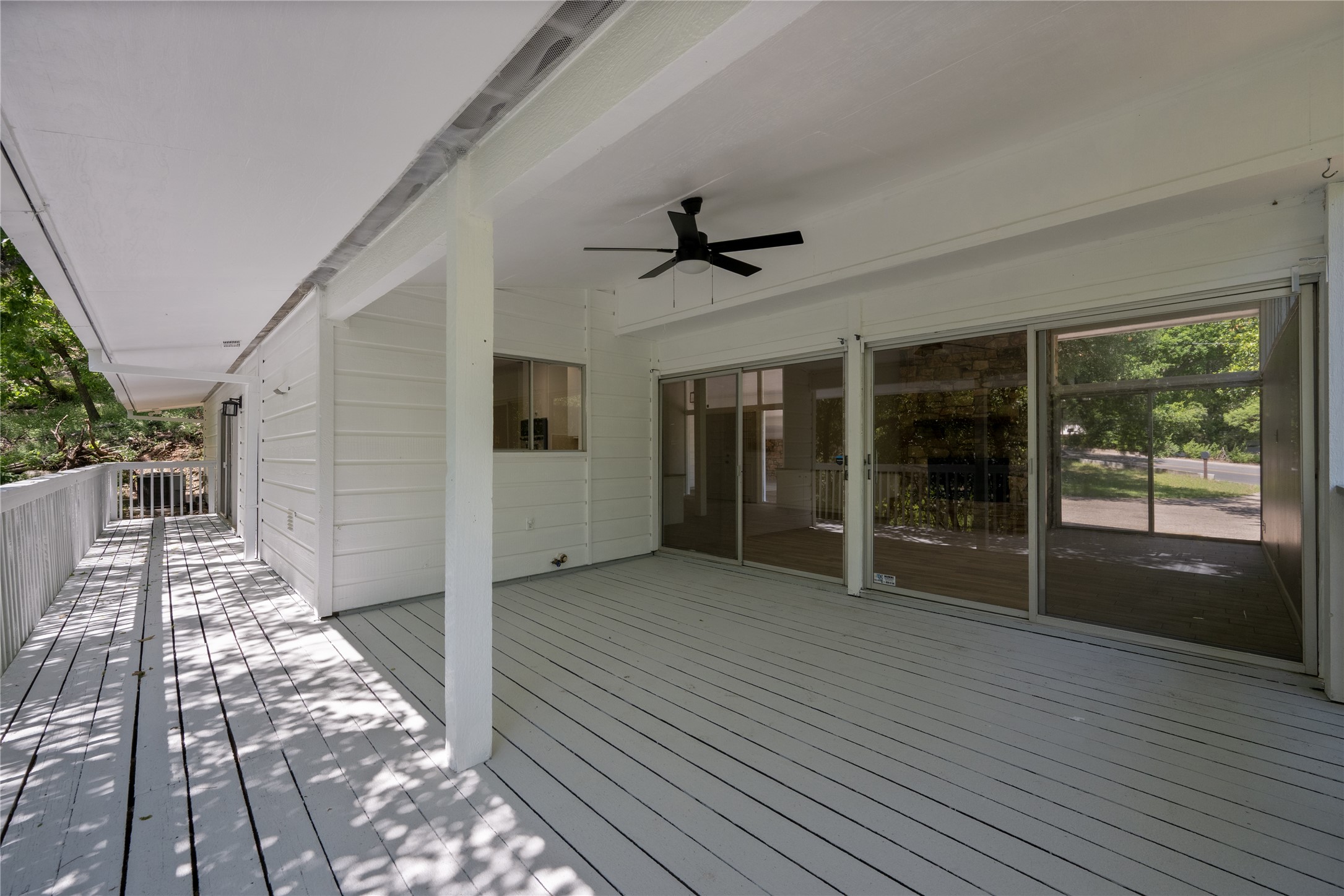7 Hull Circle Austin, TX 78746 - Photo 12 of 14 Wooden deck featuring a ceiling fan