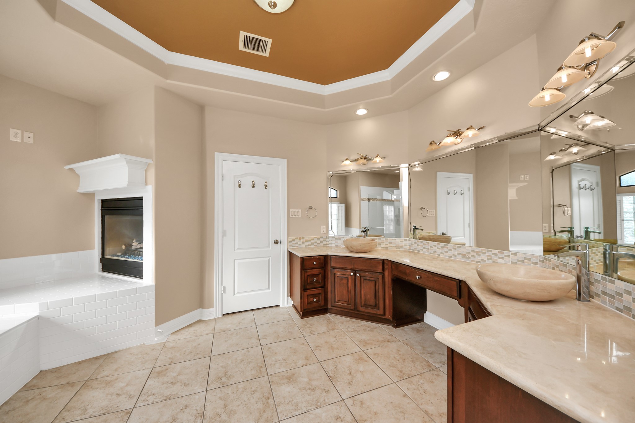 3511 River Bend Drive Rosenberg, TX 77471 - Photo 24 of 50 Expansive owner’s suite bathroom complete with a standalone shower, jetted soaking tub, and a warm fireplace accent