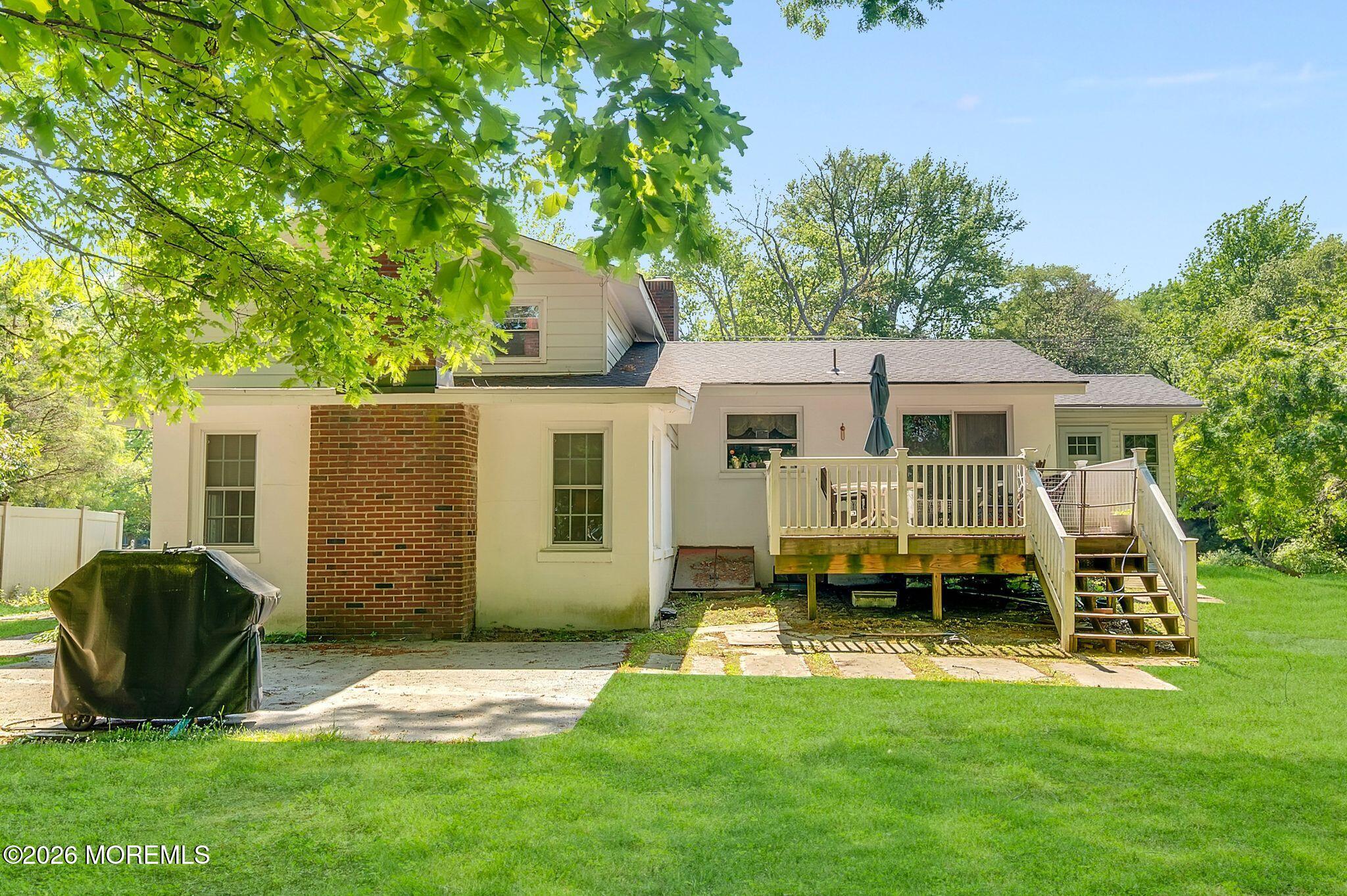 2604 Logan Road Asbury Park, NJ 07712 - Photo 27 of 39 a view of a house with a backyard and a patio