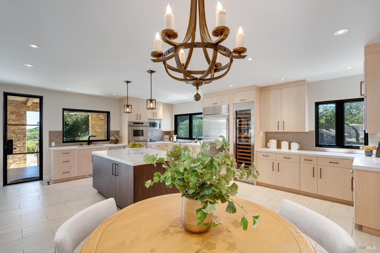 2929 Atlas Peak Road Napa, CA 94558 - Photo 16 of 56 a kitchen with stainless steel appliances granite countertop a sink a stove and a wooden floors