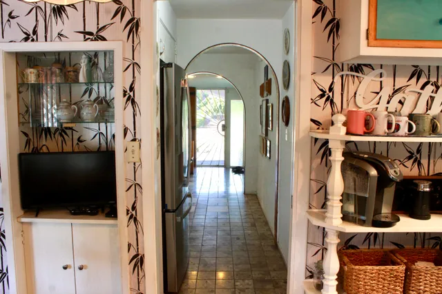 a kitchen with a stove a sink and a refrigerator