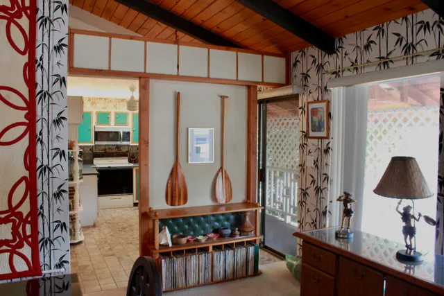 a dining room with furniture and window