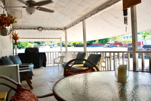 a living room with fireplace furniture and a flat screen tv