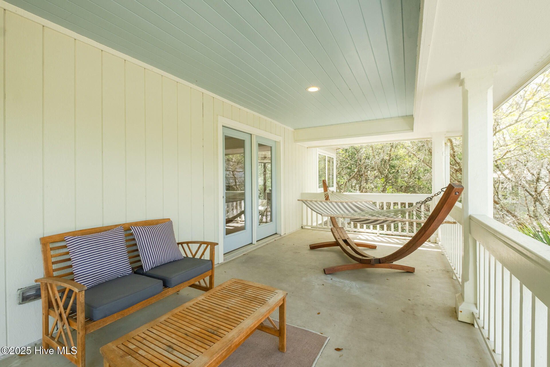 8 Racerunner Court Bald Head Island, NC 28461 - Photo 15 of 45 LOVELY COVERED PORCH UPSTAIRS OFF GREAT ROOM & DINING ROOM FACING THE CUL DE SAC