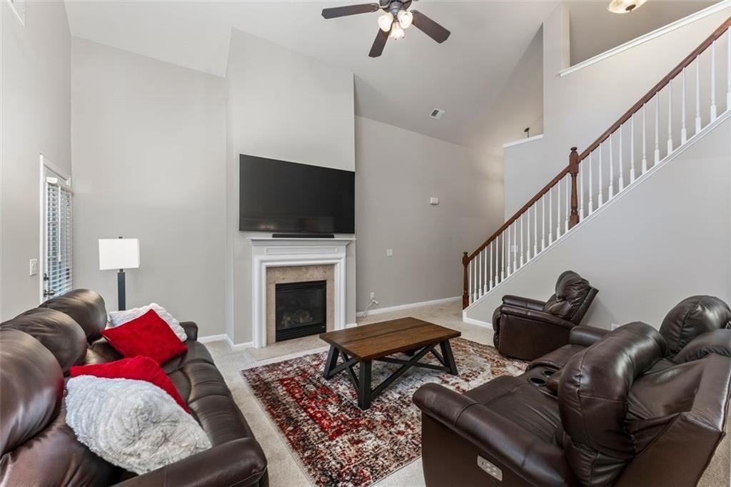 113 Tyson Woods Road Acworth, GA 30102 - Photo 10 of 37 a living room with furniture and a flat screen tv