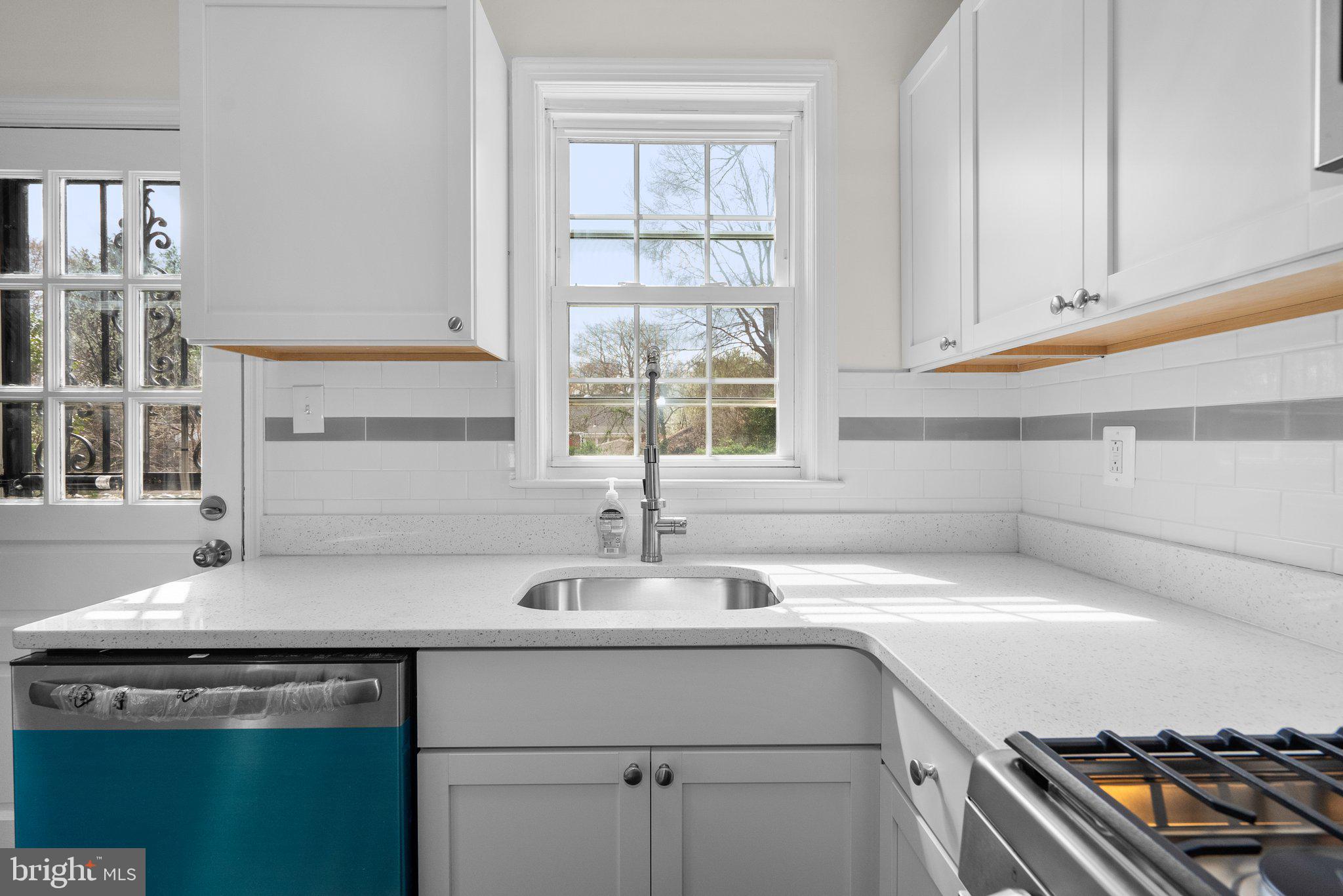 10110 McKenney Avenue Silver Spring, MD 20902 - Photo 11 of 56 a kitchen with a sink and cabinets