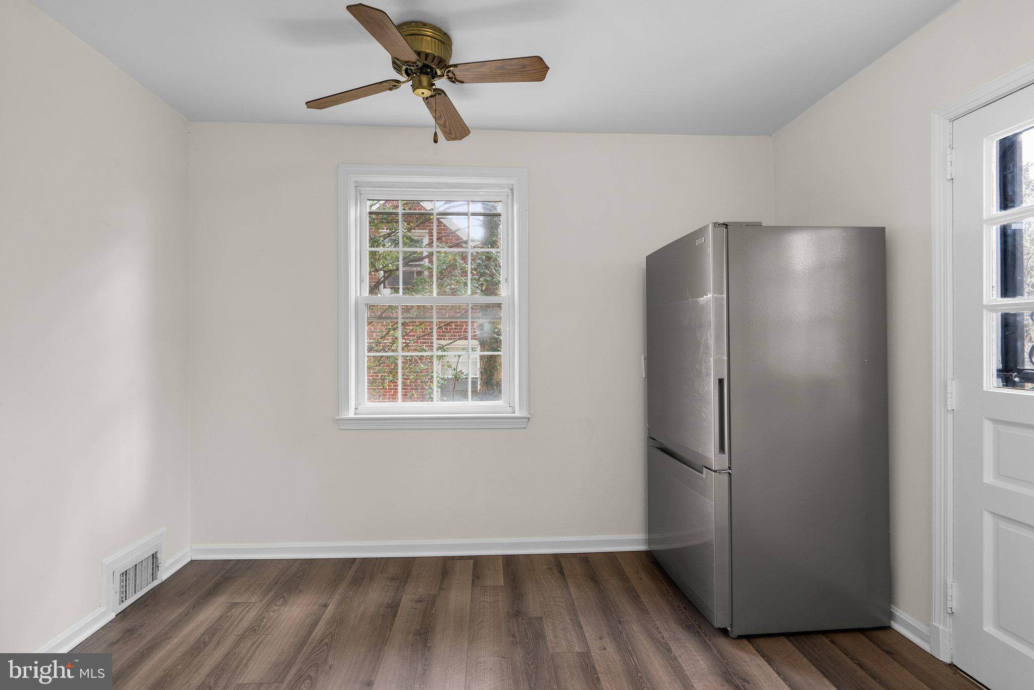 10110 McKenney Avenue Silver Spring, MD 20902 - Photo 15 of 56 a view of empty room with wooden floor and fan