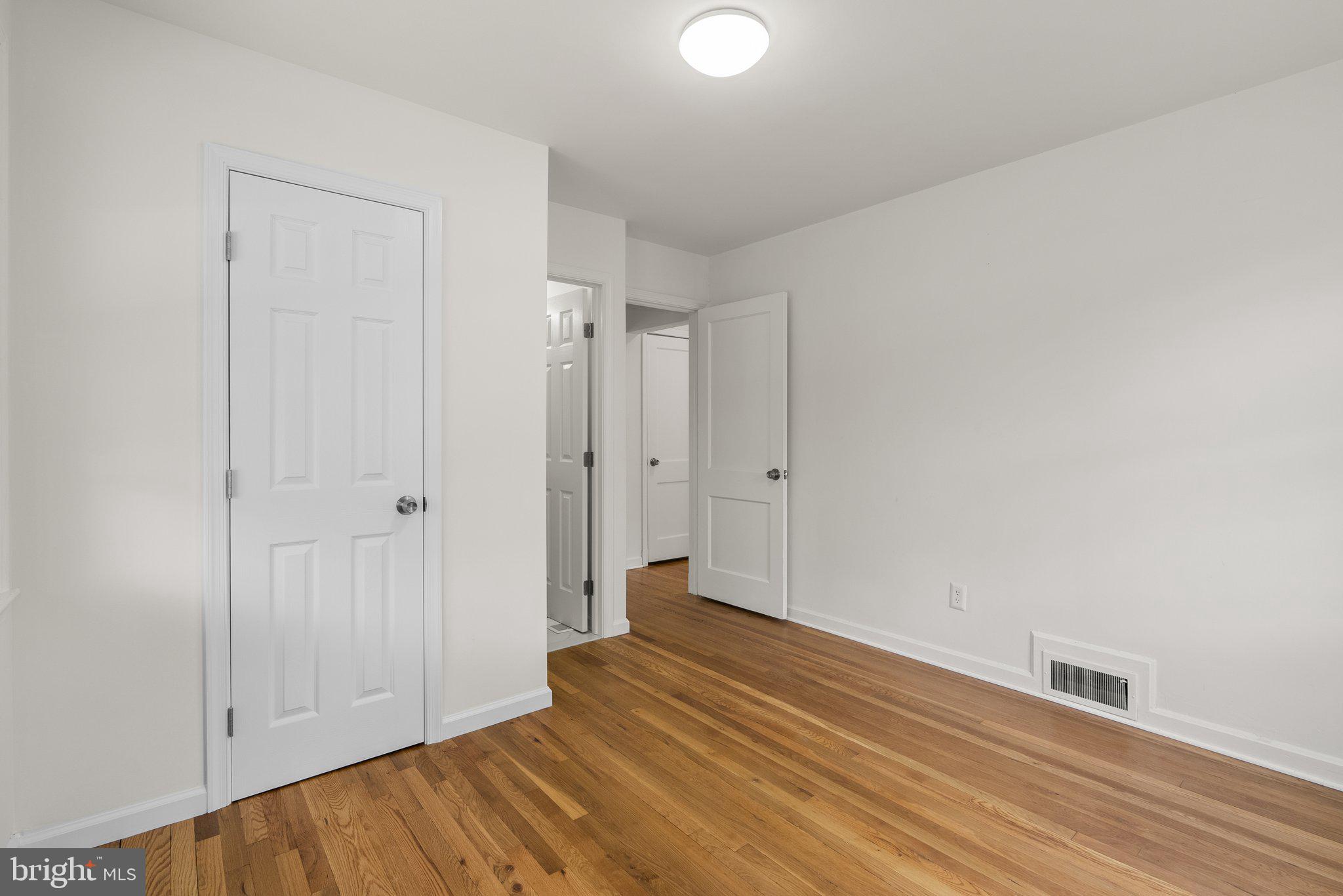 10110 McKenney Avenue Silver Spring, MD 20902 - Photo 20 of 56 a view of empty room with wooden floor