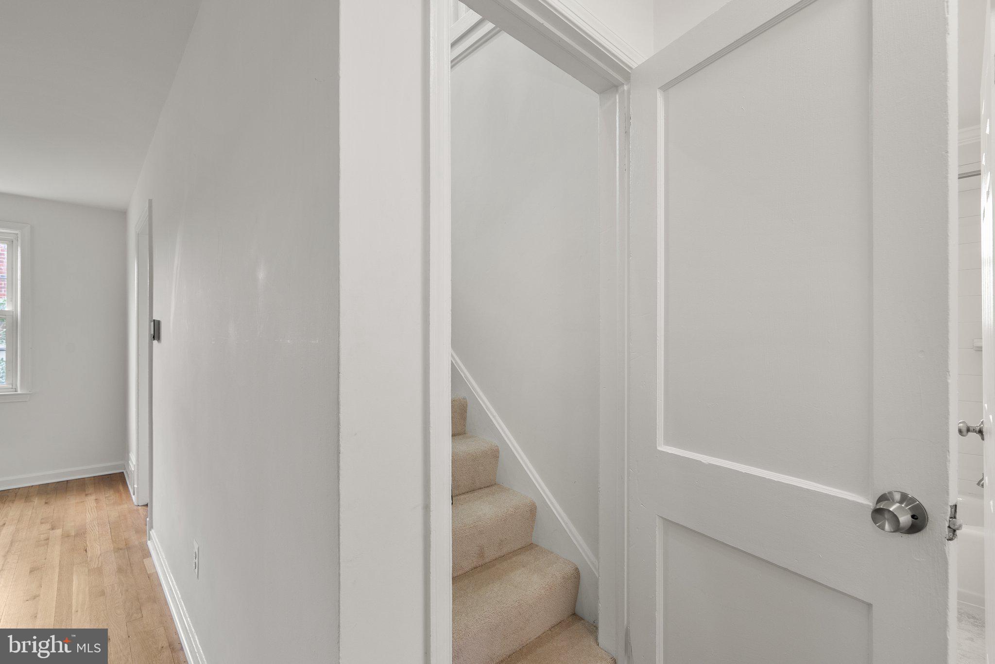 10110 McKenney Avenue Silver Spring, MD 20902 - Photo 28 of 56 a view of hallway with wooden floor