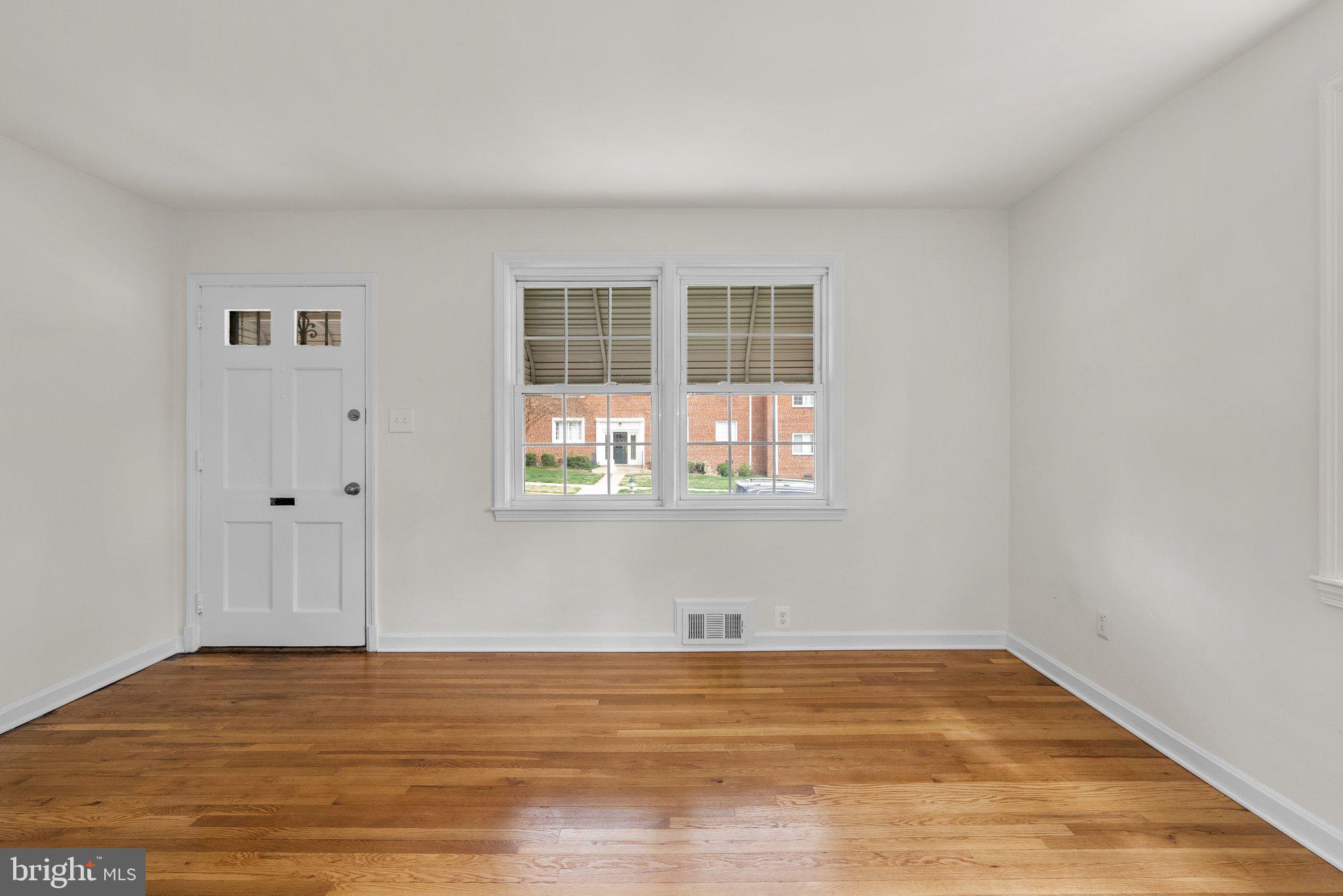 10110 McKenney Avenue Silver Spring, MD 20902 - Photo 4 of 56 a view of empty room with wooden floor and fan