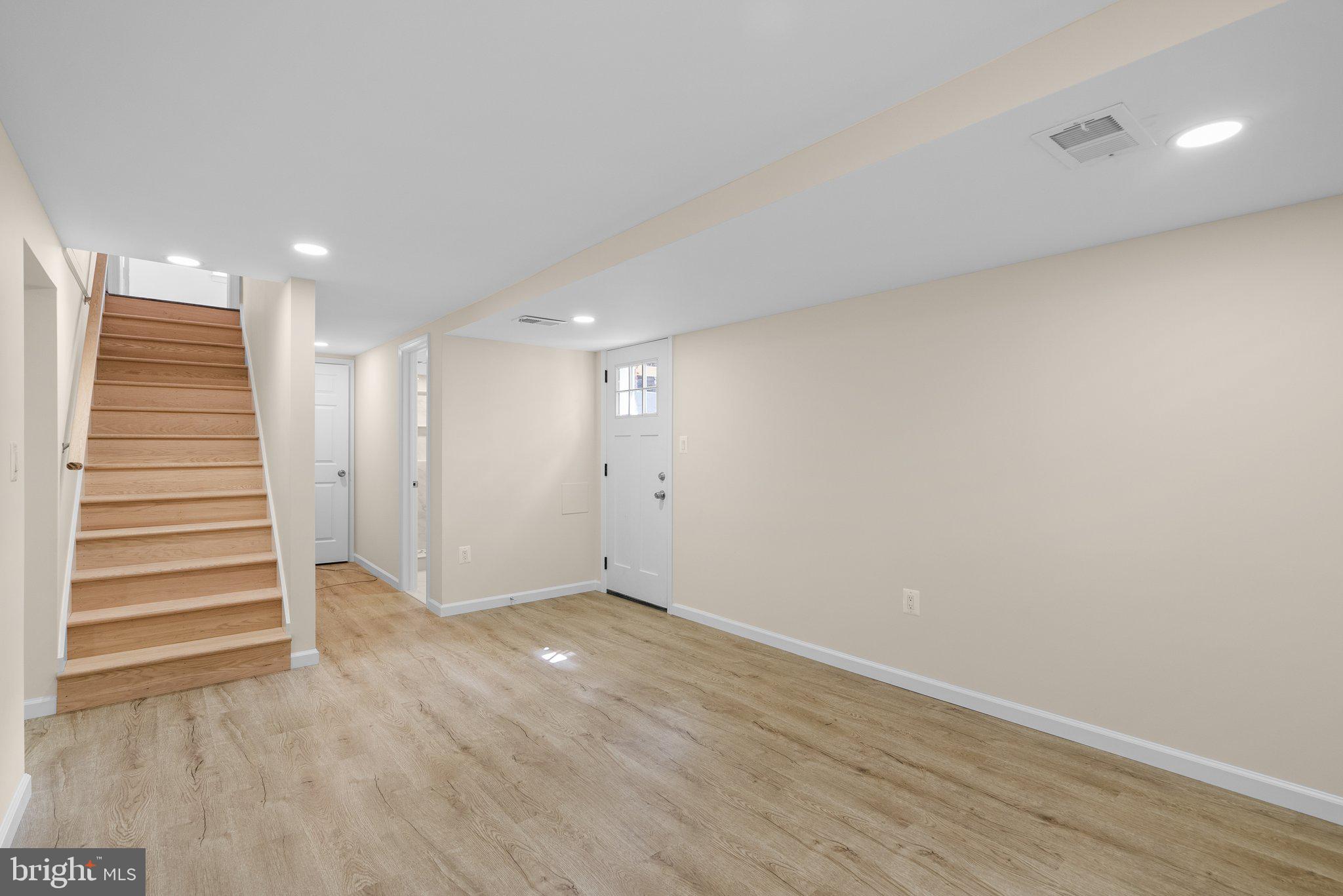 10110 McKenney Avenue Silver Spring, MD 20902 - Photo 42 of 56 wooden floor in an empty room with a window