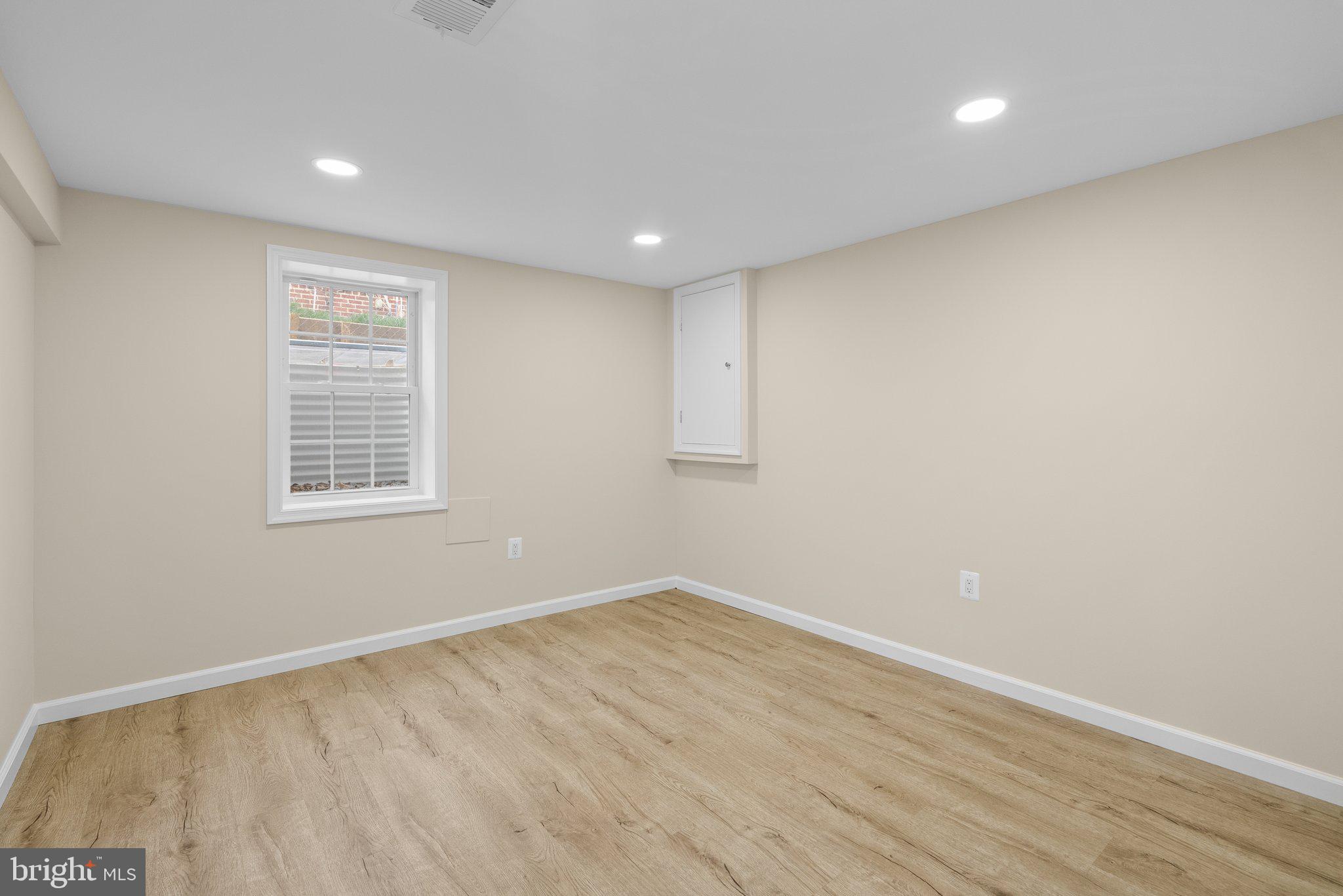10110 McKenney Avenue Silver Spring, MD 20902 - Photo 43 of 56 a view of empty room with wooden floor and fan