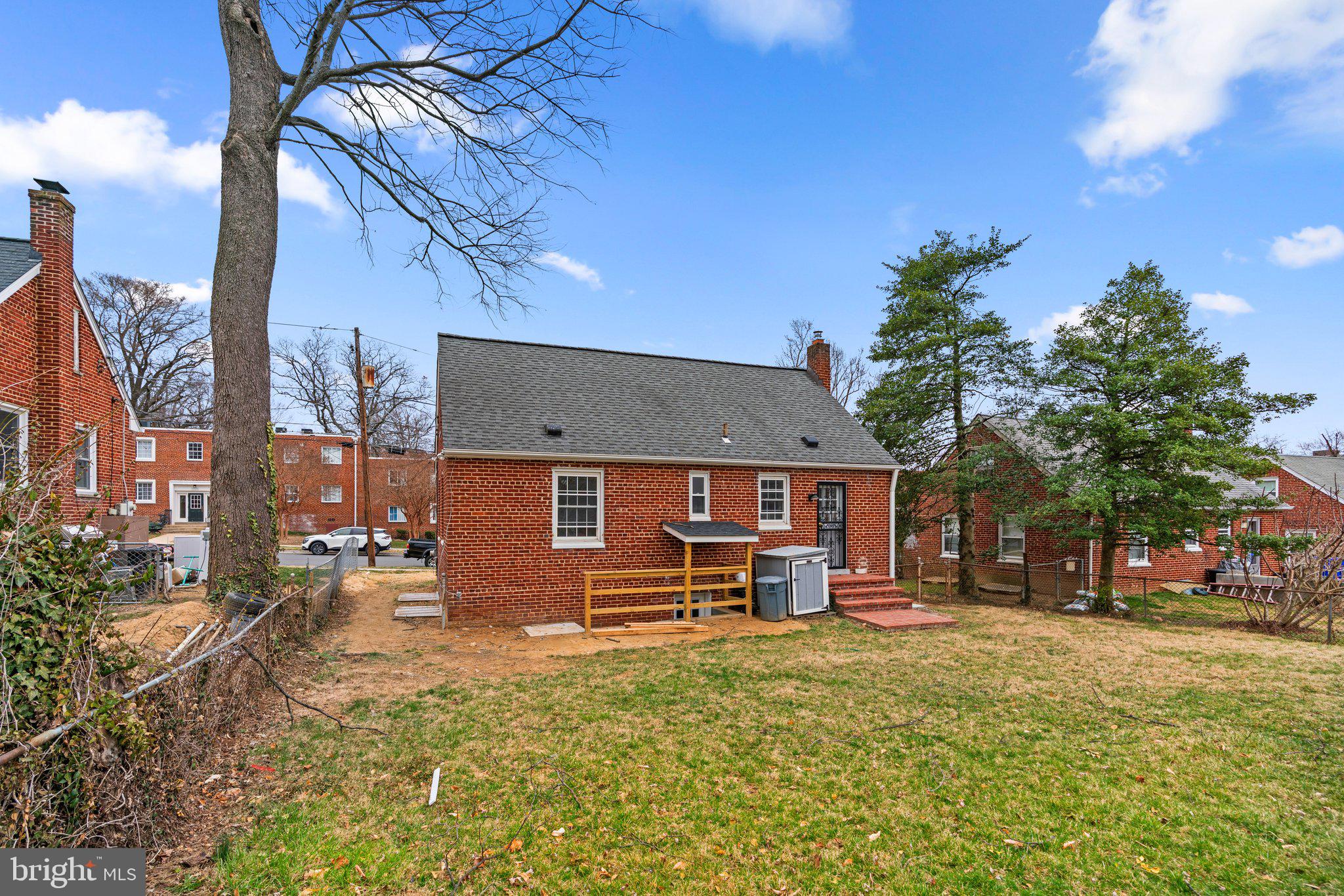 10110 McKenney Avenue Silver Spring, MD 20902 - Photo 51 of 56 a view of a house with a yard covered in the forest