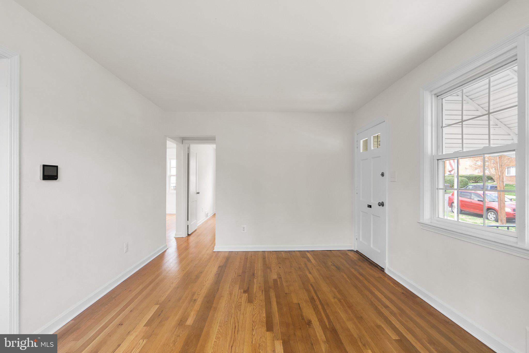 10110 McKenney Avenue Silver Spring, MD 20902 - Photo 7 of 56 a view of empty room with wooden floor and fan