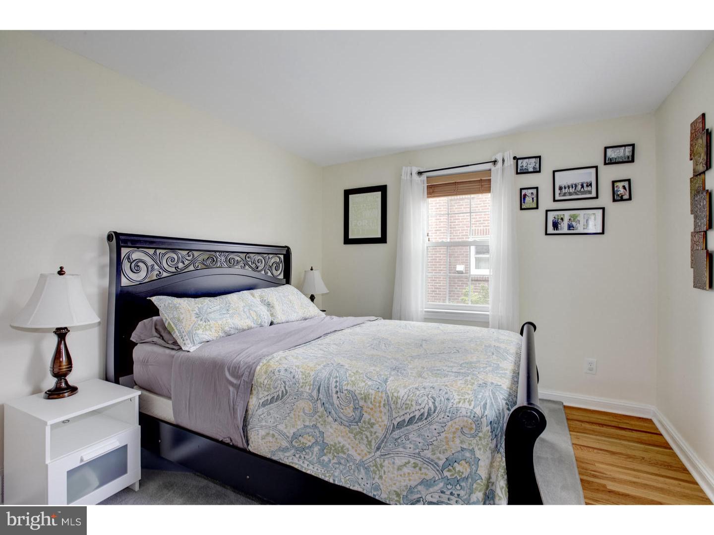 532 Lawrence Road Havertown, PA 19083 - Photo 14 of 22 a bedroom with a bed and a table in it