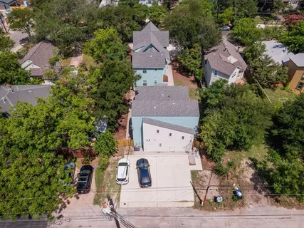 an aerial view of multiple houses with outdoor space