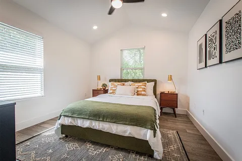 a bedroom with a bed and a window