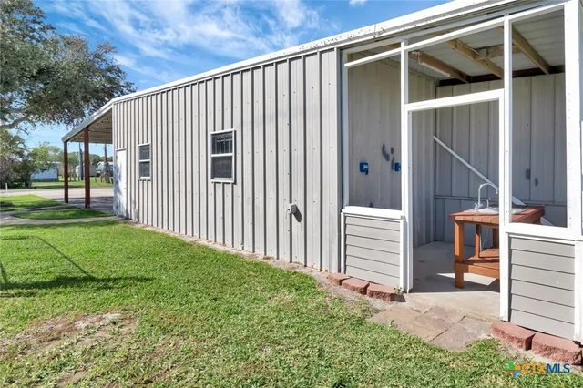 an aerial view of house with swimming pool