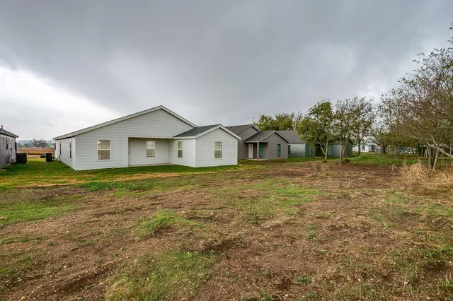 a house view with a garden space