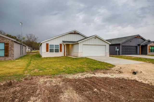 a house with swimming pool in front of it