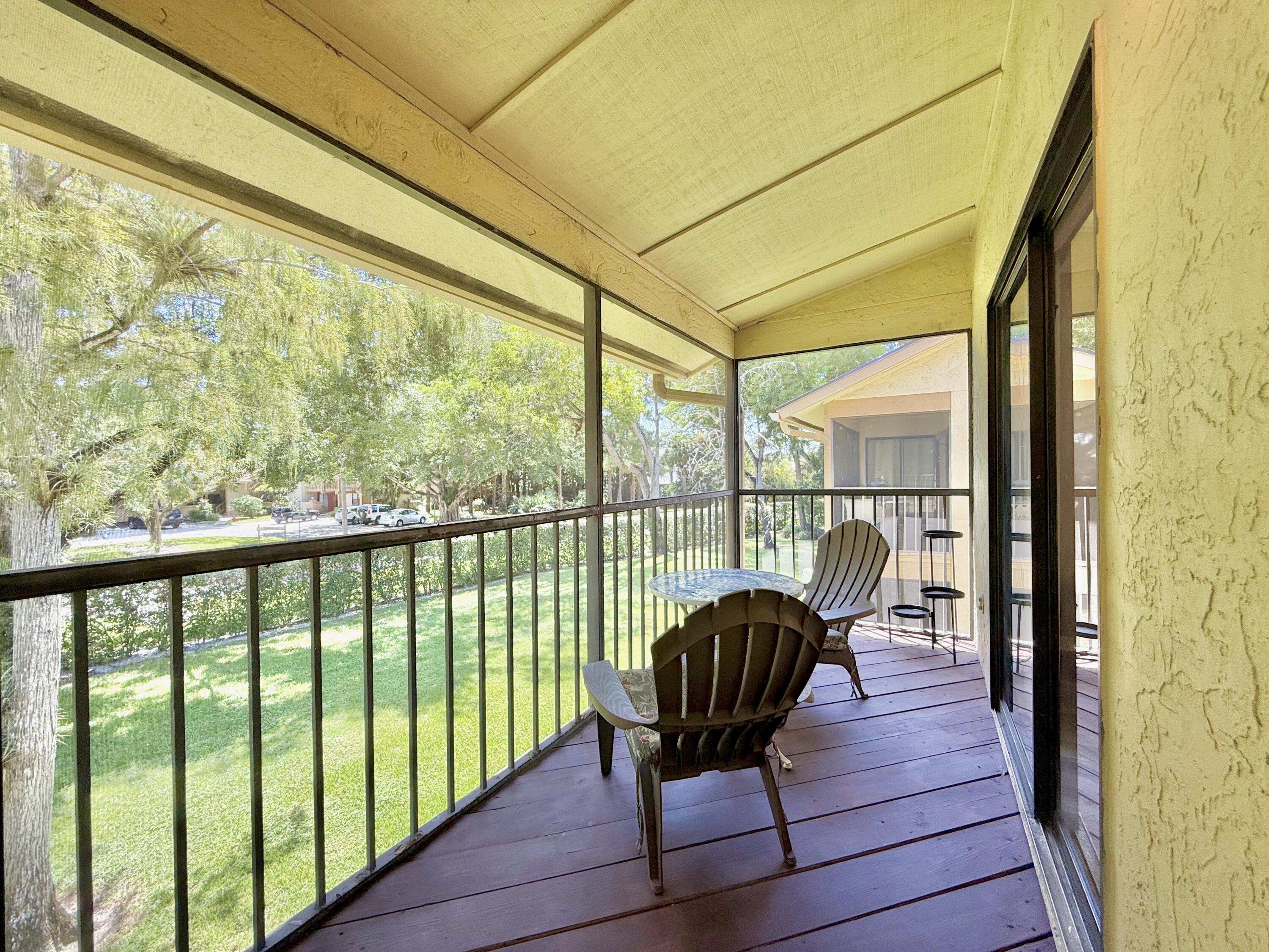 12969 Pennypacker Trail, Unit 15 Wellington, FL 33414 - Photo 12 of 24 a view of a chair in the balcony